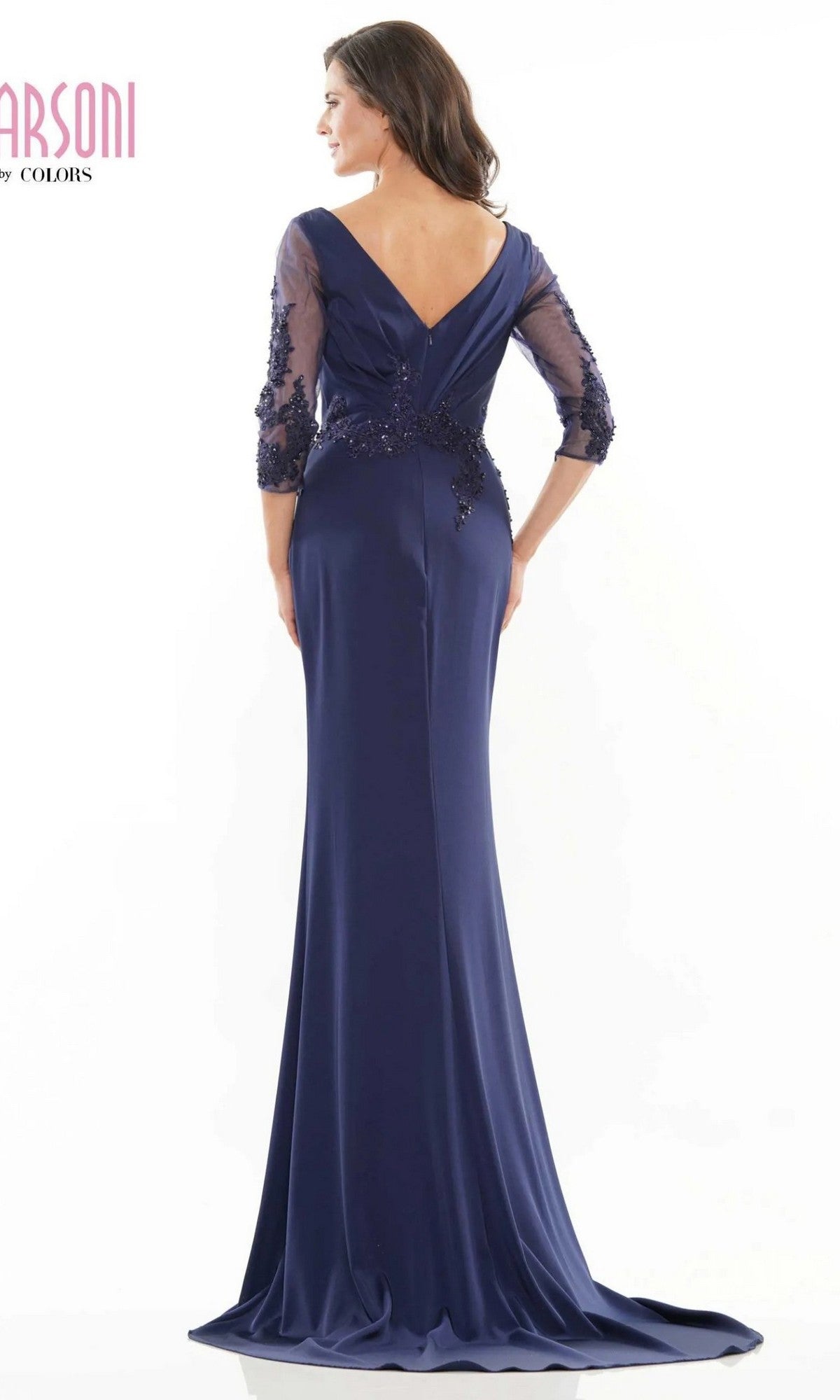 A woman is shown from the back wearing the Long Formal Dress: Marsoni MV1145 in dark blue, featuring sheer three-quarter sleeves and beaded embellishments, against a white background.